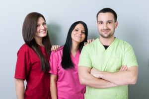 three medical staff smiling